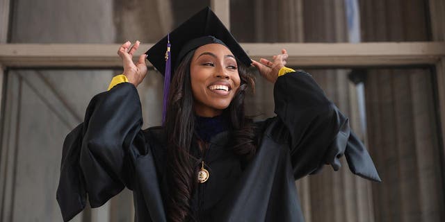 Areanah Preston in a cap and gown