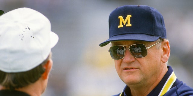 Bo Schembechler talks with a referee