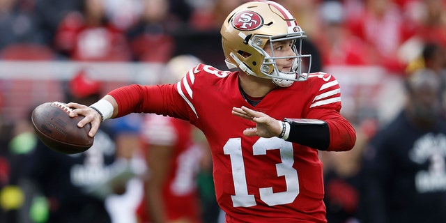 Brock Purdy throws a pass