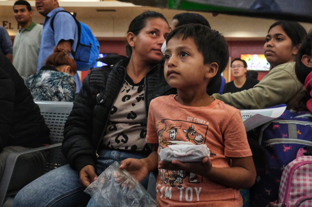 Local groups and churches give immigrants food and clothing.