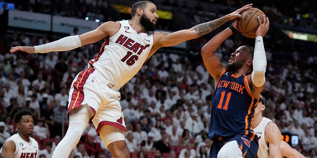 Miami Heat players attempts to block a shot