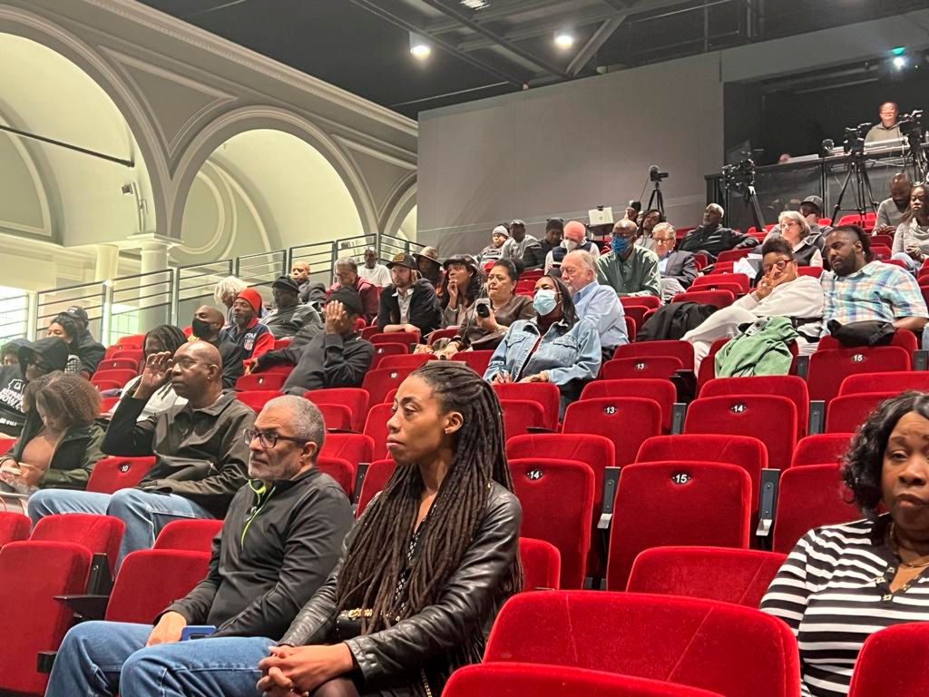 People listen to the California reparations task force at a meeting at Lesser Hall in Mills College at Northeastern University in Oakland, Calif. on May 6, 2023.