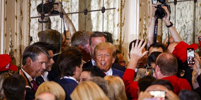 Former US President Donald Trump departs after delivering remarks at the Mar-a-Lago Club