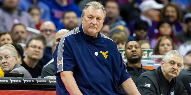 Bob Huggins coaches during the Big 12 Tournament