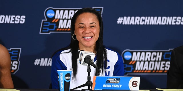 Dawn Staley talks to the media