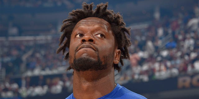 Julius Randle looks on before a playoff game