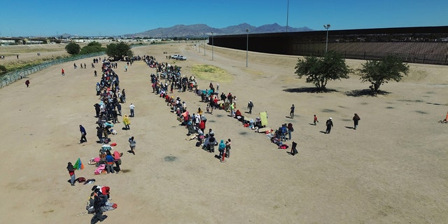 Migrants crossing into the US