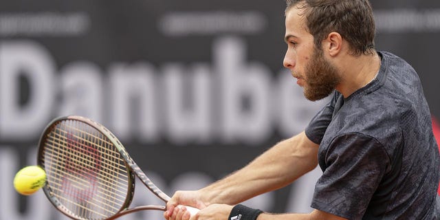 Hugo Gaston plays a shot during the 2023 Austria Open