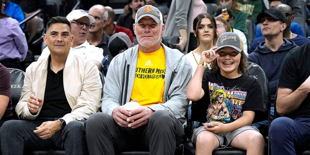 Brett Favre attends an NBA basketball game