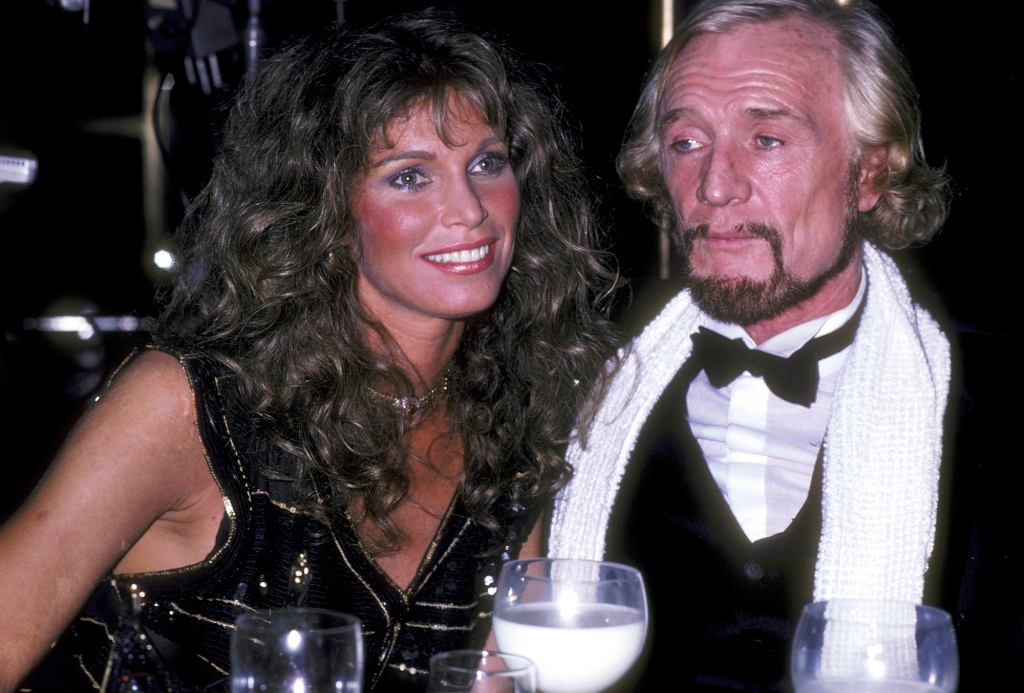 Harris with his second wife, Anne Turkel, in 1981 at a party for music producer Richard Perry at the Rainbow Room. He's wearing a tuxedo with a white scarf around his neck and she's wearing a black dress. They're both looking in different directions; she's smiling, he's not.