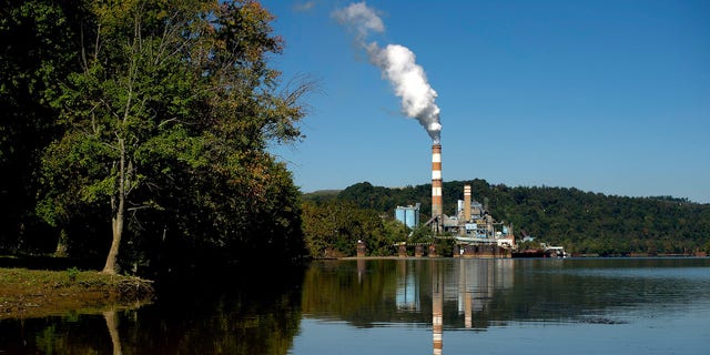 NEW EAGLE, PA - SEPTEMBER 24: A plume of exhaust extends from the Mitchell Power Station, a coal-fired power plant built along the Monongahela River, 20 miles southwest of Pittsburgh, on September 24, 2013 in New Eagle, Pennsylvania. The plant, owned by FirstEnergy, will be one of two plants in the region to be shut down, affecting 380 employees. The Evironmental Protection Agency (EPA) and the Obama administration have been taking major steps to get coal-fired power plants into compliance with clean air regulations. (Photo by Jeff Swensen/Getty Images)