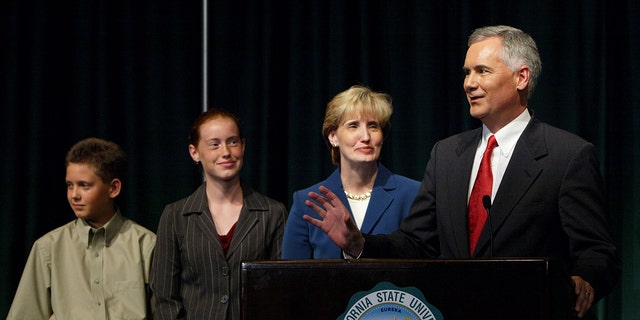 Tom McClintock speaks to reporters with wife