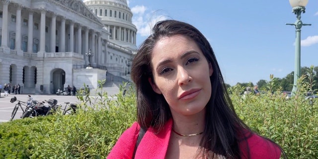 Rep. Anna Paulina Luna interviewing with the dome of the U.S. Capitol behind her.