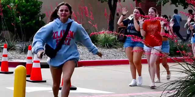 A girl is running away from a mall