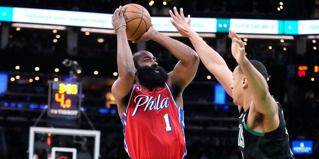 James Harden shoots over Malcolm Brogdon