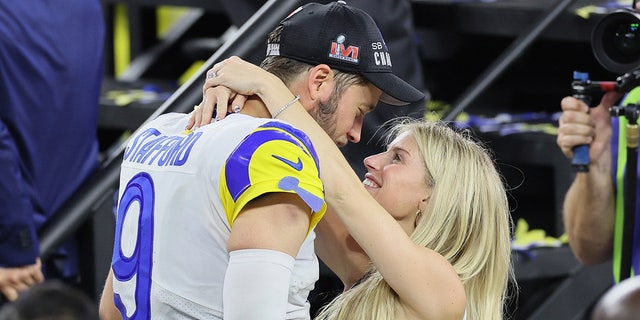 Kelly Stafford hugs her husband