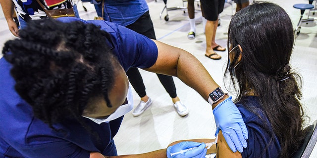 girl gets vaccine