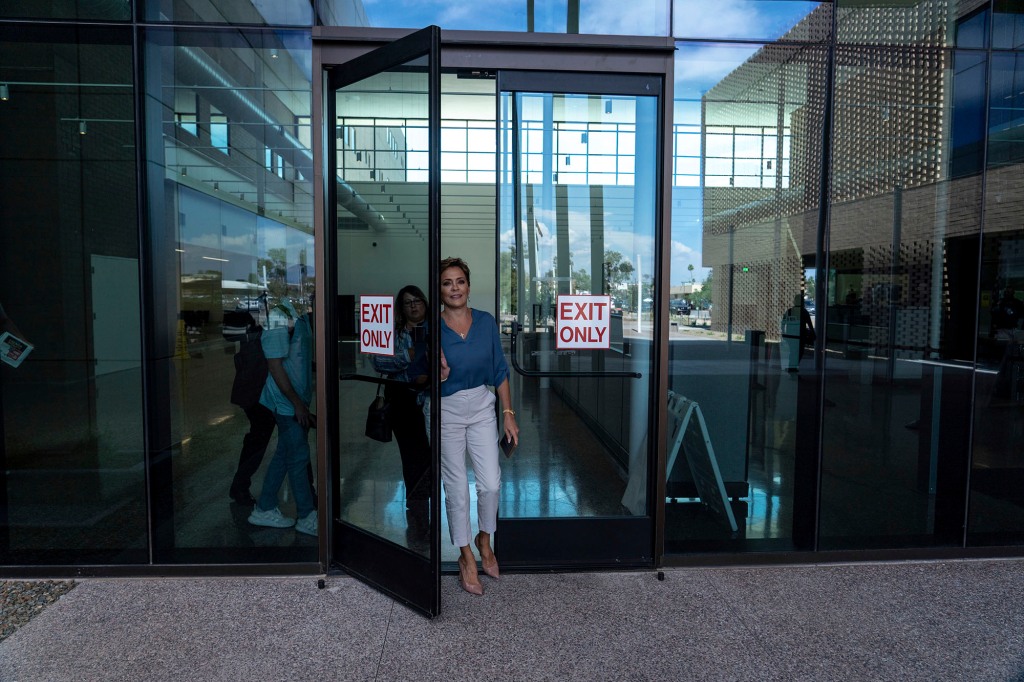 Kari Lake exits Maricopa County Superior Court after hearing closing arguments by attorneys at her election challenge trial in Mesa, Ariz., on Friday, May 19, 2023.