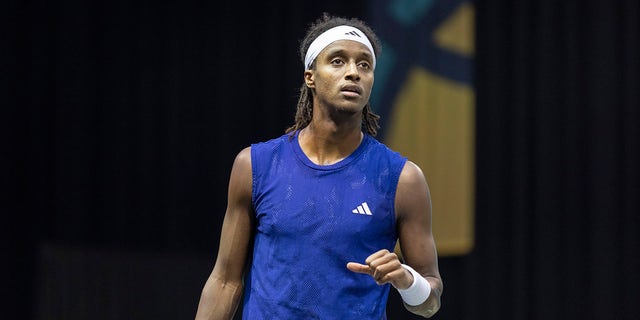 Mikael Ymer looks on court