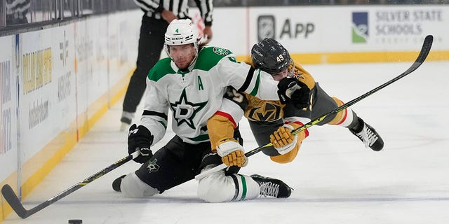 Miro Heiskanen fights for the puck