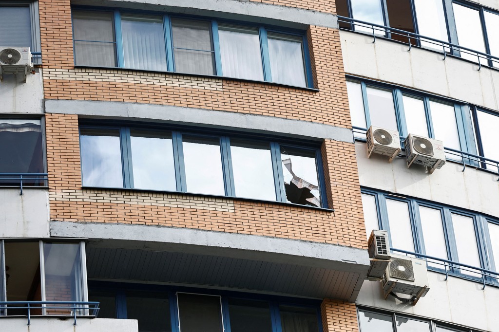 A view shows a broken window in a multi-storey apartment block following a reported drone attack in Moscow, Russia, May 30, 2023.