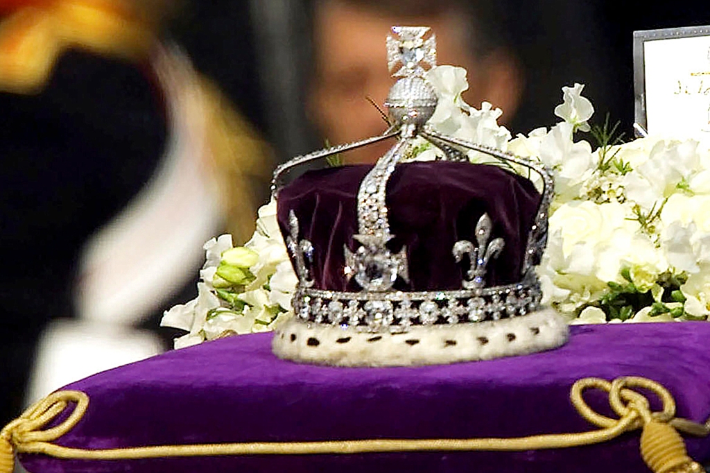 The Koh-i-noor, or "mountain of light," diamond, set in the Maltese Cross at the front of the crown made for Britain's late Queen Mother Elizabeth, is seen on her coffin as it is drawn to London's Westminster Hall.