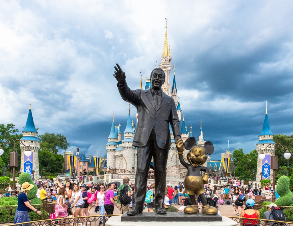 Walt Disney and Mickey Mouse statue inside of the Magic Kingdom in Orlando, Fla.