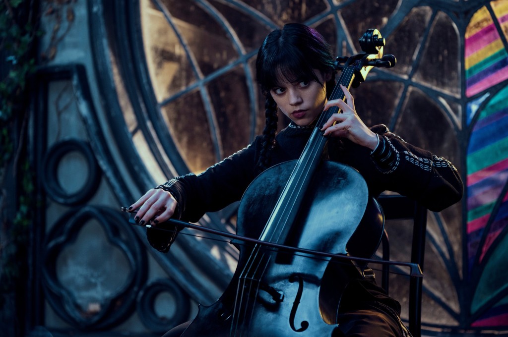 Wednesday Addams playing cello