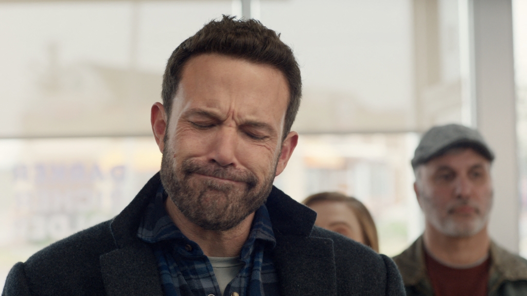 Affleck's brings his trademark grumpy face to his Dunkin commercial.