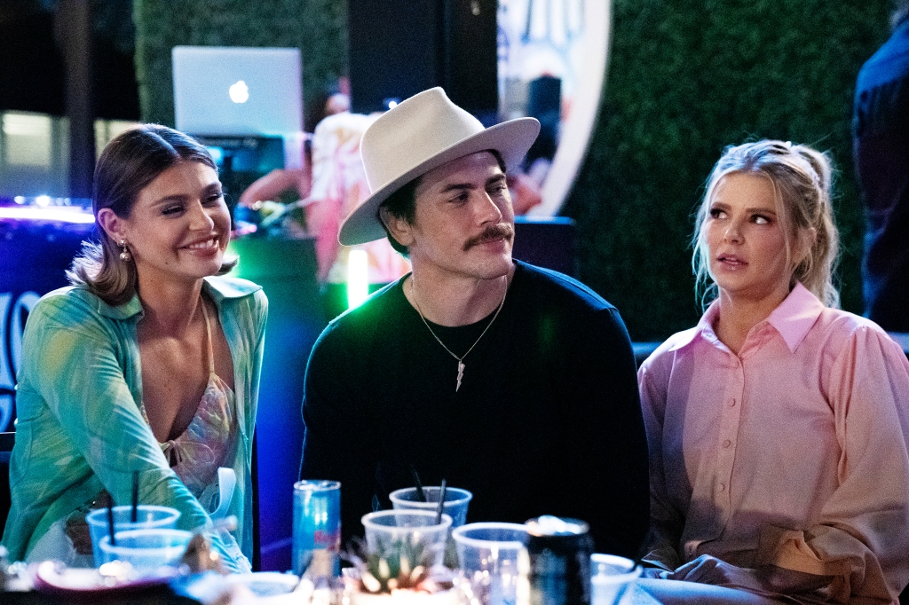 Raquel Leviss, Tom Sandoval and Ariana Madix sitting at a table together. 