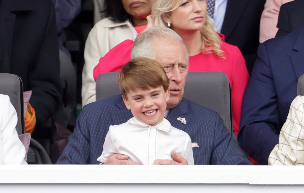 Prince Louis sits on his grandfather's lap during the Platinum Jubilee celebration.