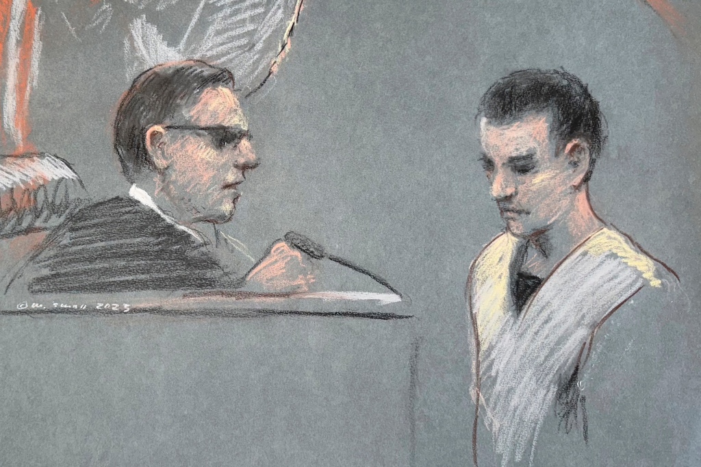 Massachusetts Air National Guardsman Jack Teixeira, right, appears in U.S. District Court in Boston, Friday, April 14, 2023. 