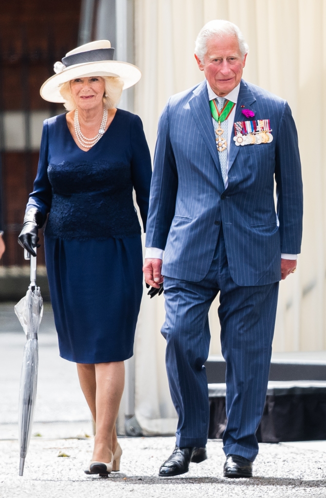 Charles and Camilla, meet with French President Emmanuel Macron during a ceremony at Carlton Gardens on June 18, 2020.