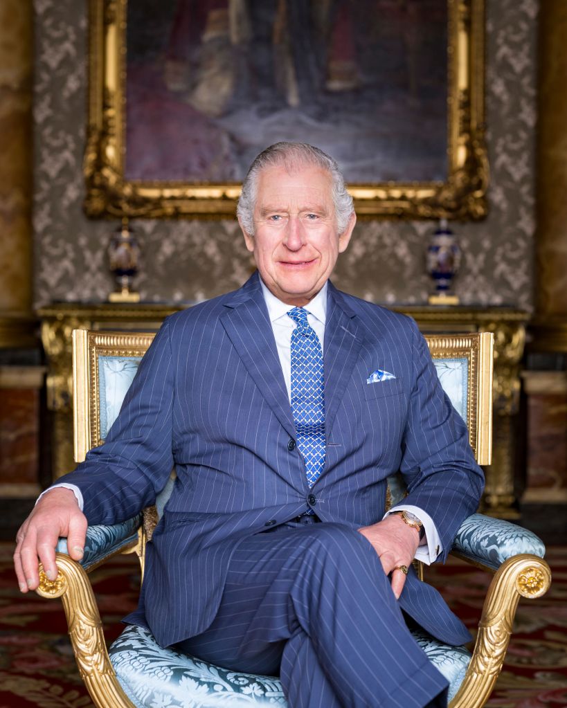 King Charles III poses for a photograph, in the Blue Drawing Room at Buckingham Palace, London.