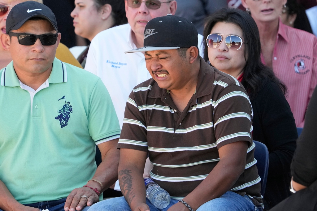 Grieving father and husband Wilson Garcia broke down during a vigil for his family. 