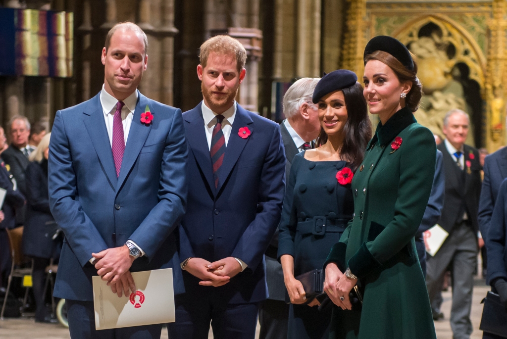 Princes William and Harry with Kate Middleton and Meghan Markle.