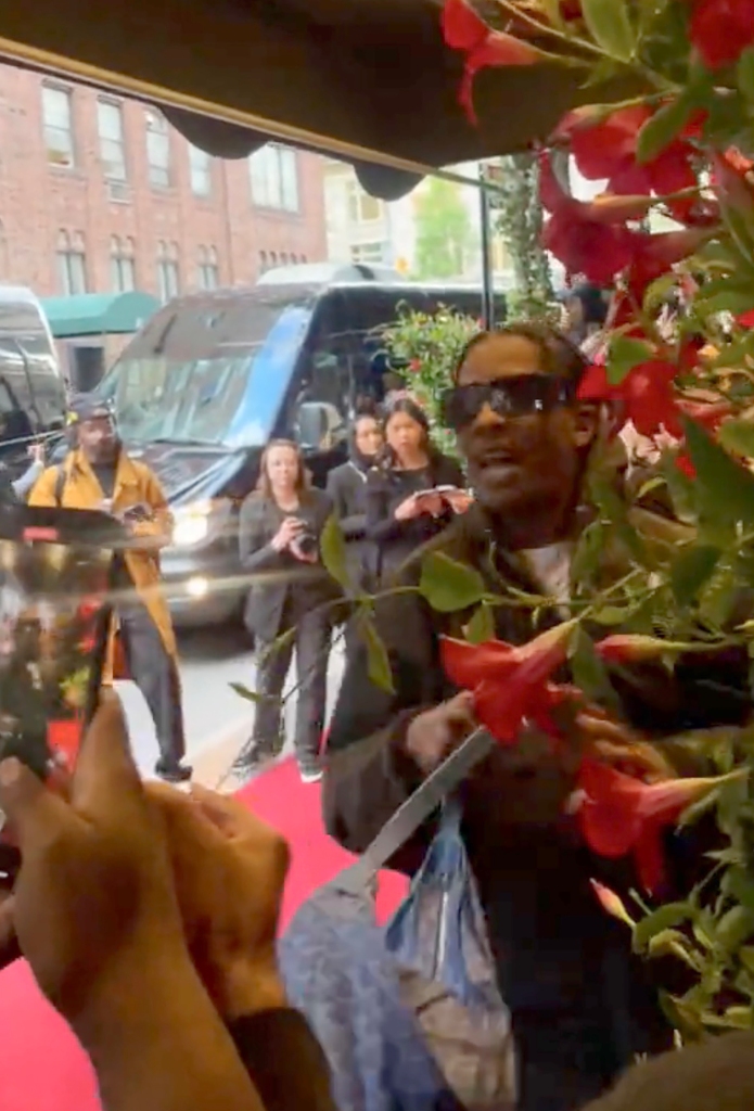 He gave fans a wave as he entered the hotel. 