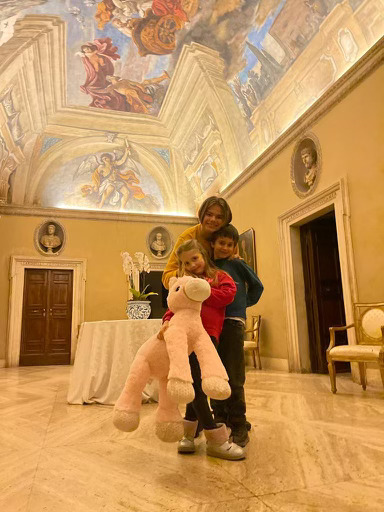 Ukrainian refugee children Elisabetta, Vlad, and brother Alessandro (rear) played under the priceless ceiling fresco painted by Italian Baroque painter Guercino at the Villa Aurora before they were evicted.