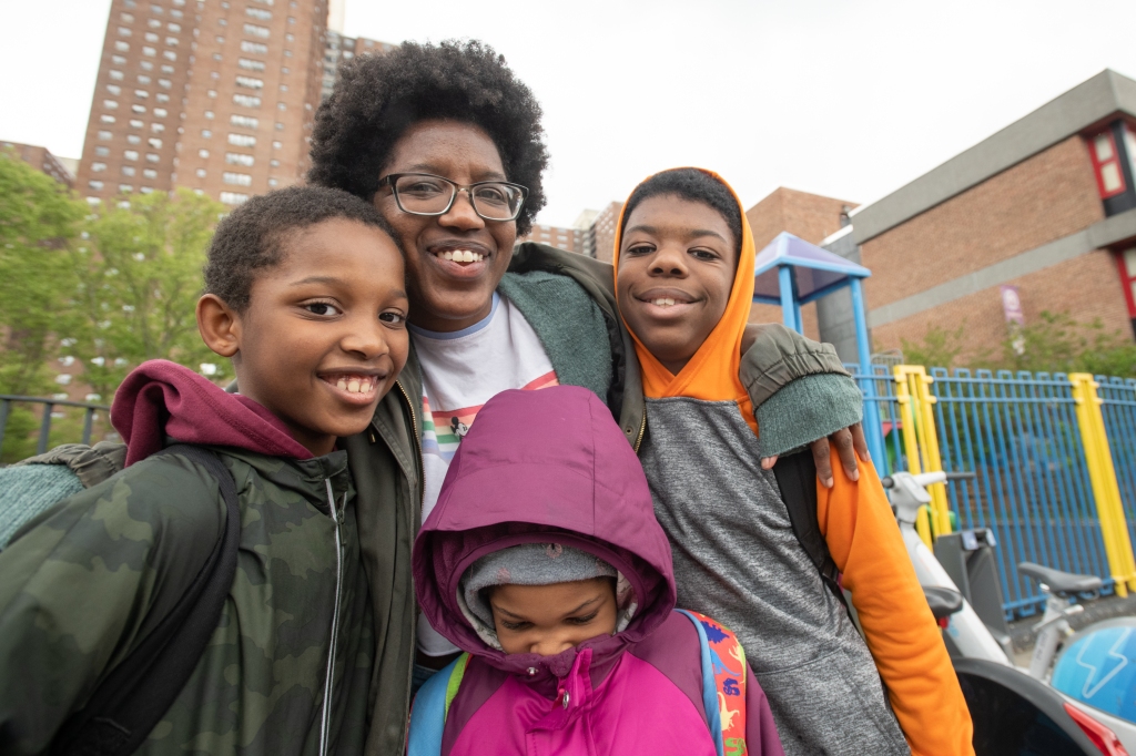 Joshelle Ellerbe posing with her three children. 