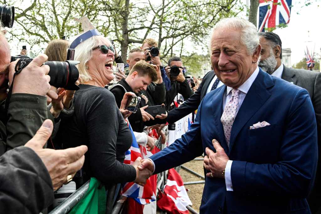 King Charles meeting the public and shaking hands ahead of the coronation. 