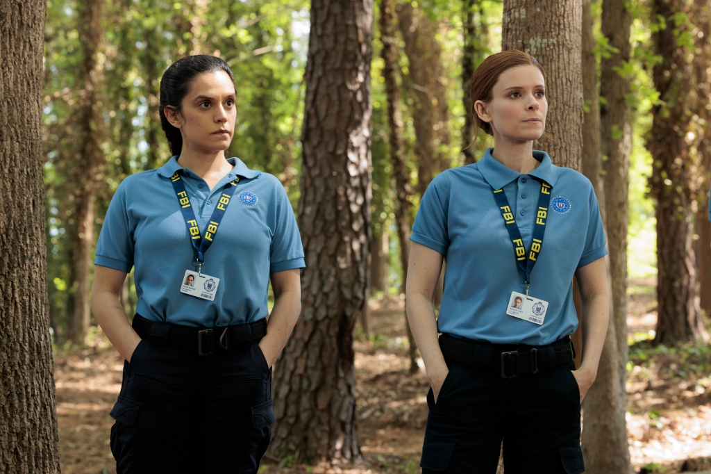 Sepideh Moafi as Hour and Kate Mara as Poet in "Class of 09" stand next to each other in the woods. 