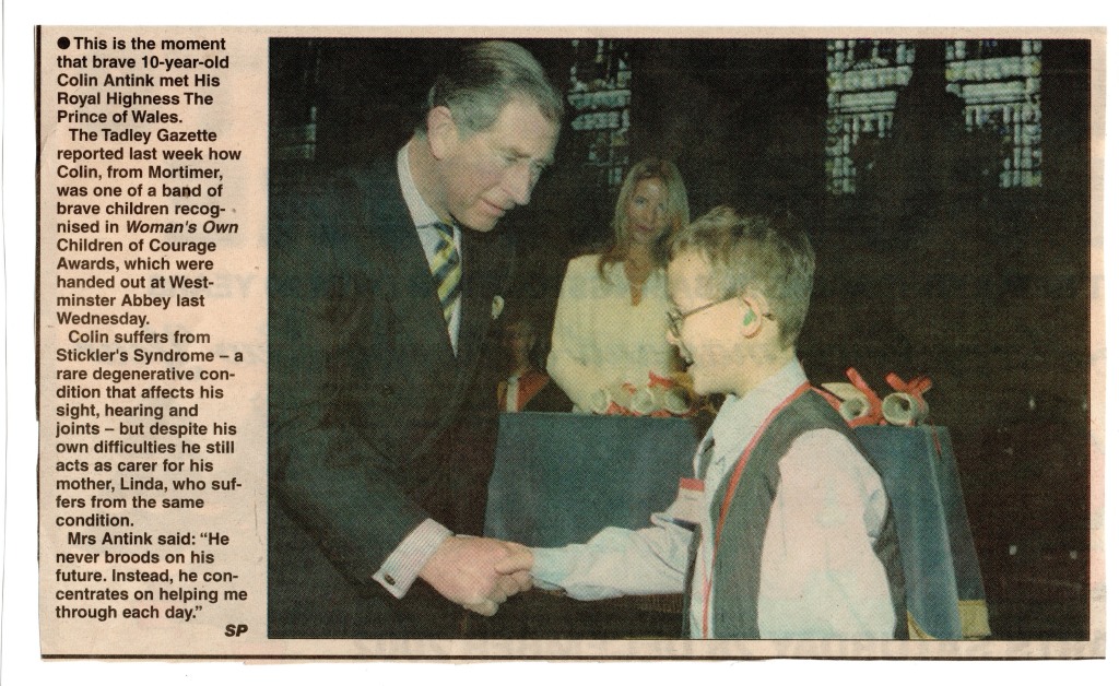 A newspaper clipping showing Colin meeting Charles in 2002.