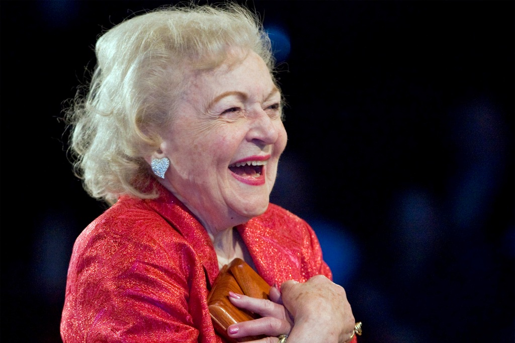 Actress Betty White reacts to the Hallmark Gospel Choir as they sing for her birthday at Crown Center in Kansas City on Jan. 20, 2011. 