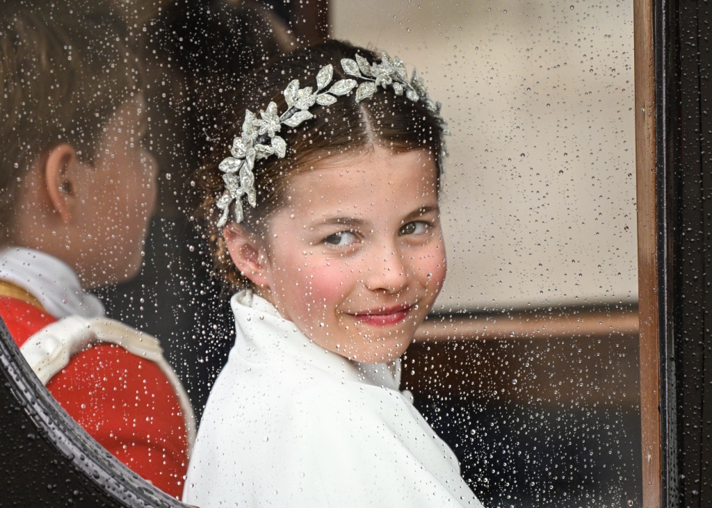 Princess Charlotte gives a smirk as she arrives at Westminster Abbey on Saturday. 
