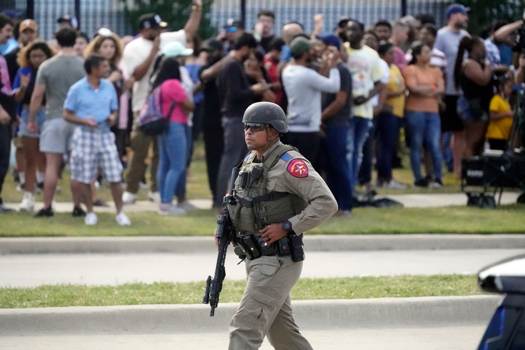 Shoppers ran out as officers closed off the outlet mall where eight people were killed. 