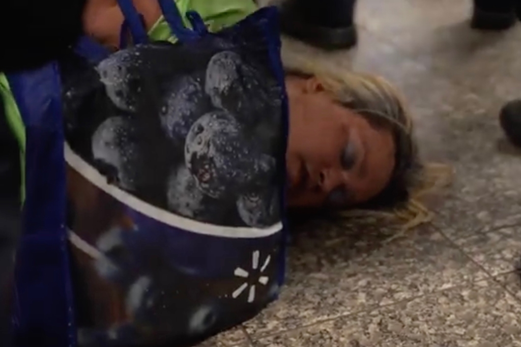 Protestor on the train floor.