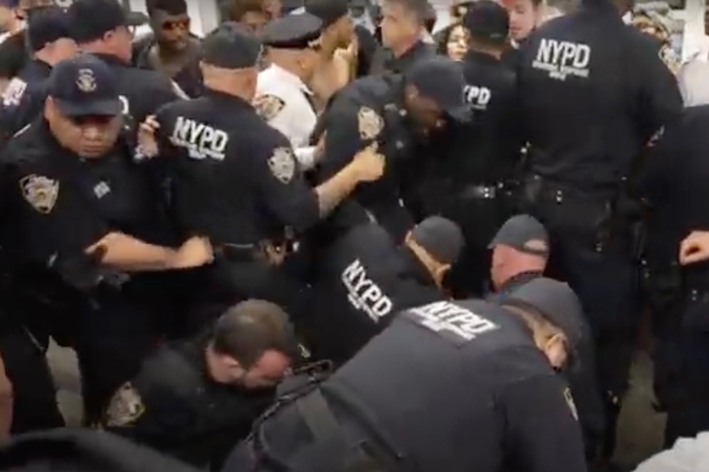 Protestors and police clash in the subway.