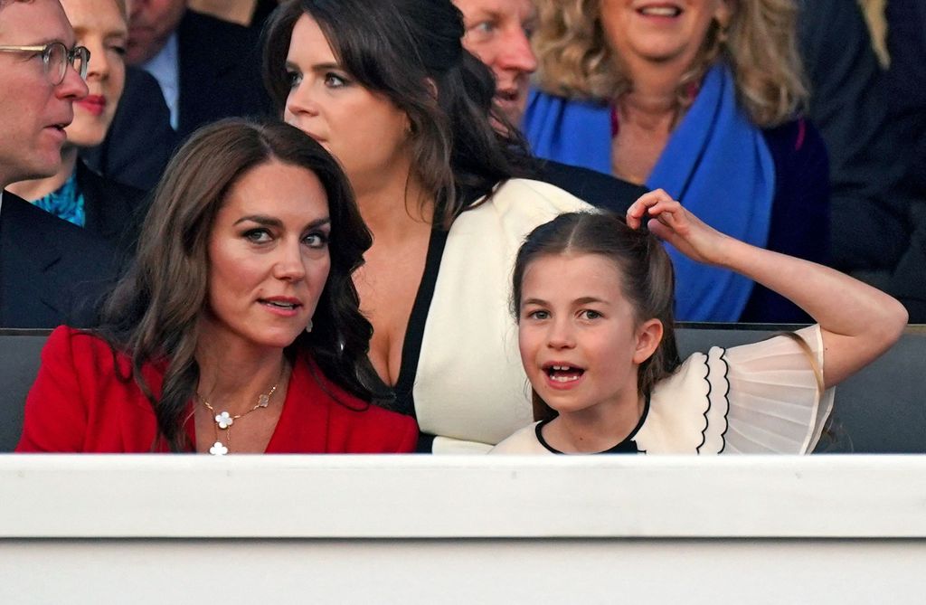 Kate Middleton and Charlotte seated at conoation concert.