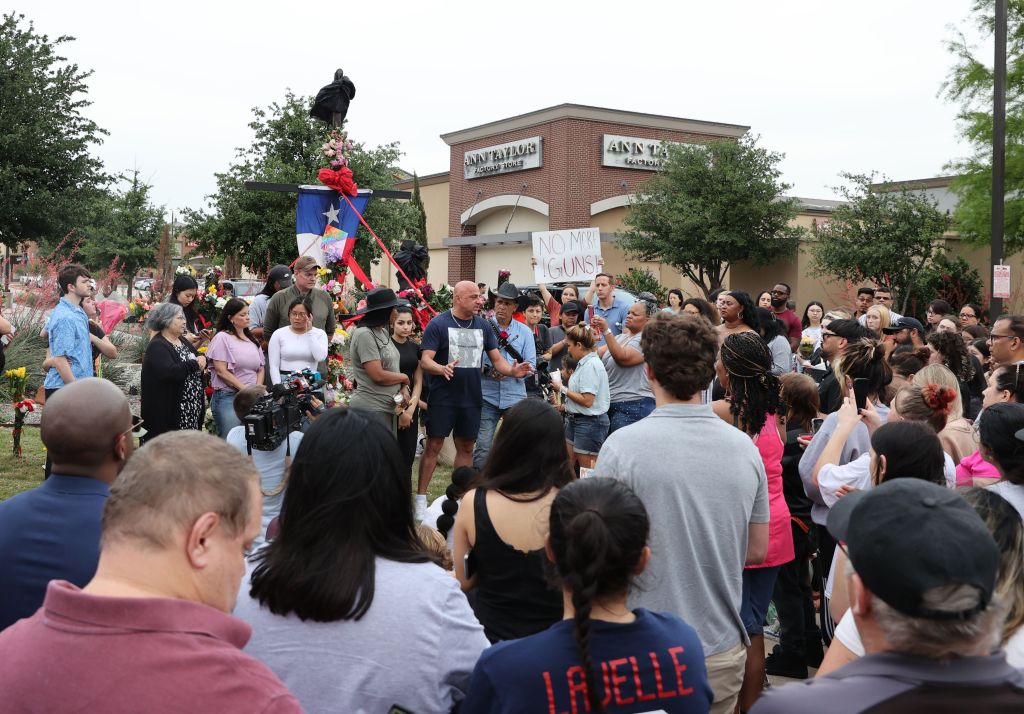 The vigil for the victims included protests calling for gun reform. 