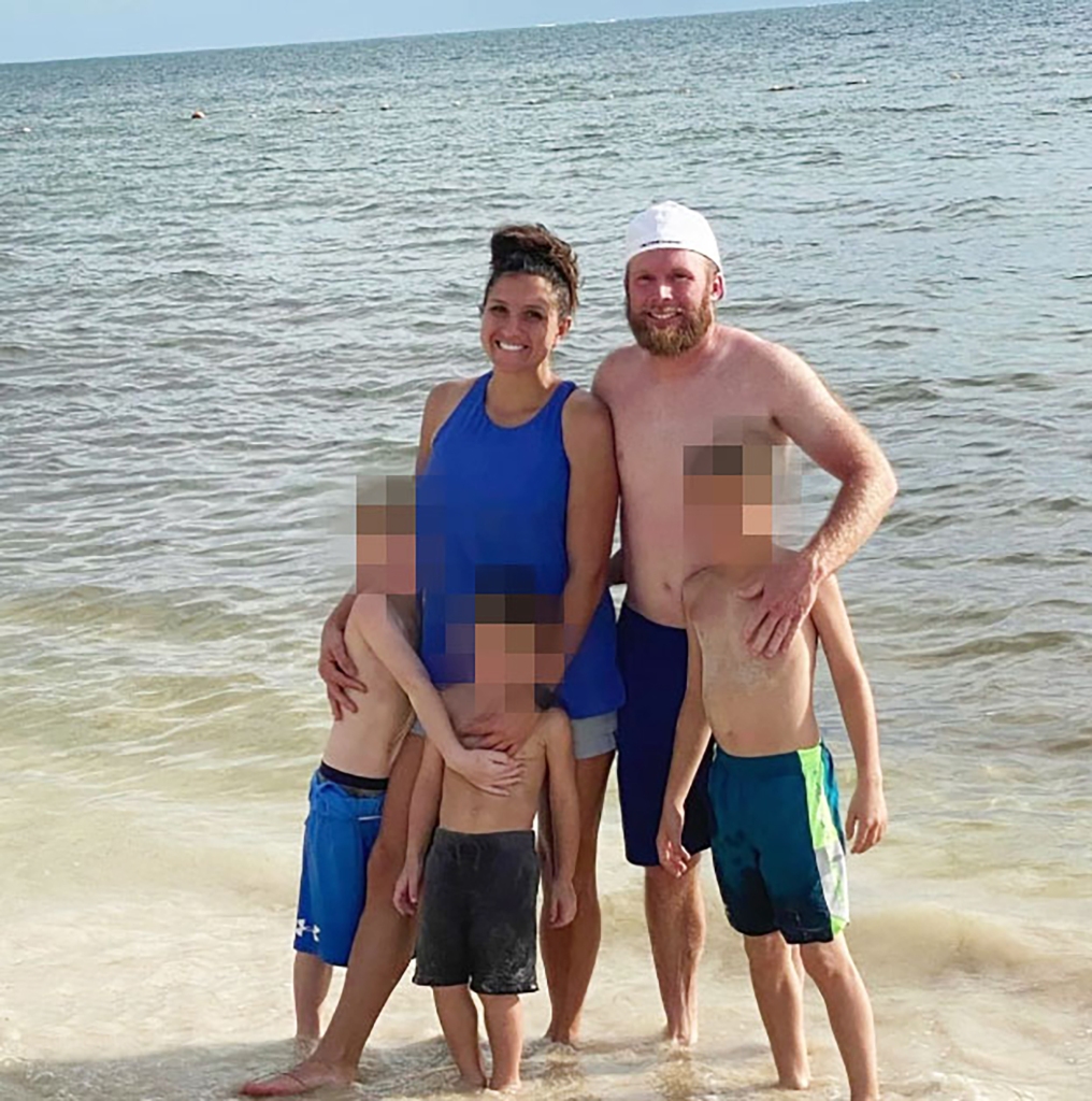 Kouri and Eric Richins with their three kids on a beach